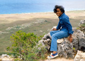 Wilcommen, No. 0084 Young Indigenous Man in Jean Jacket and Pants Sits on Rock Overlooking Northern Cliffs of Saipan